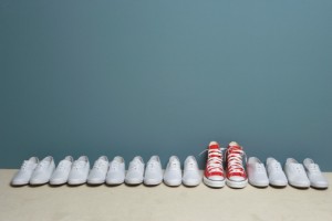 Pair of shoes in row against wall